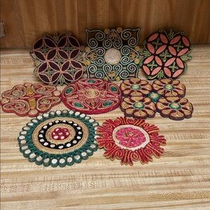 Set of 8 colorful trivets. All shapes and sizes and patterns!!
